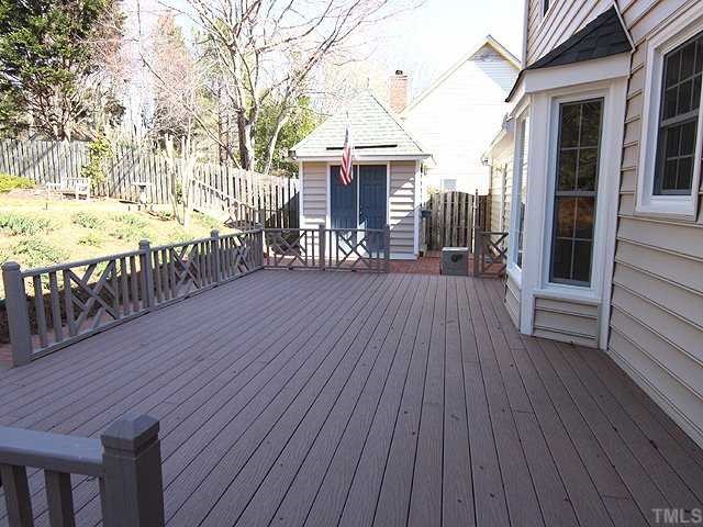 6921 Three Bridges Circle Raleigh, NC 27613 - Photo 10 of 12 a view of a house with wooden floor next to a yard
