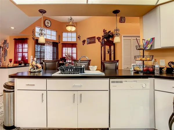 a kitchen with counter top space and cabinets