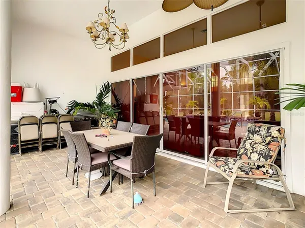 a view of swimming pool with outdoor seating