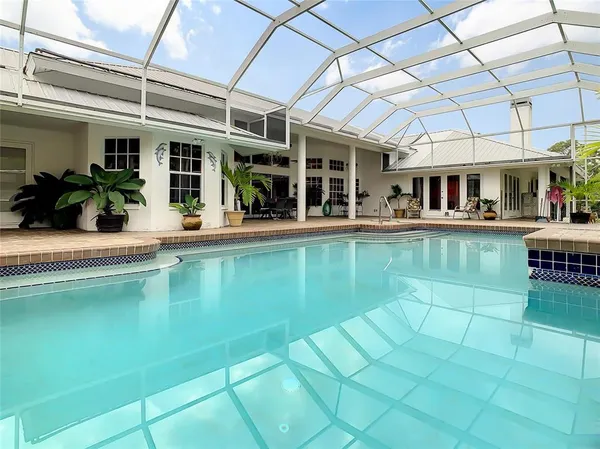a view of a swimming pool with a patio