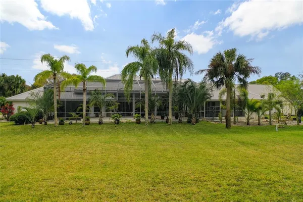 a view of a wooden staircase with white fence