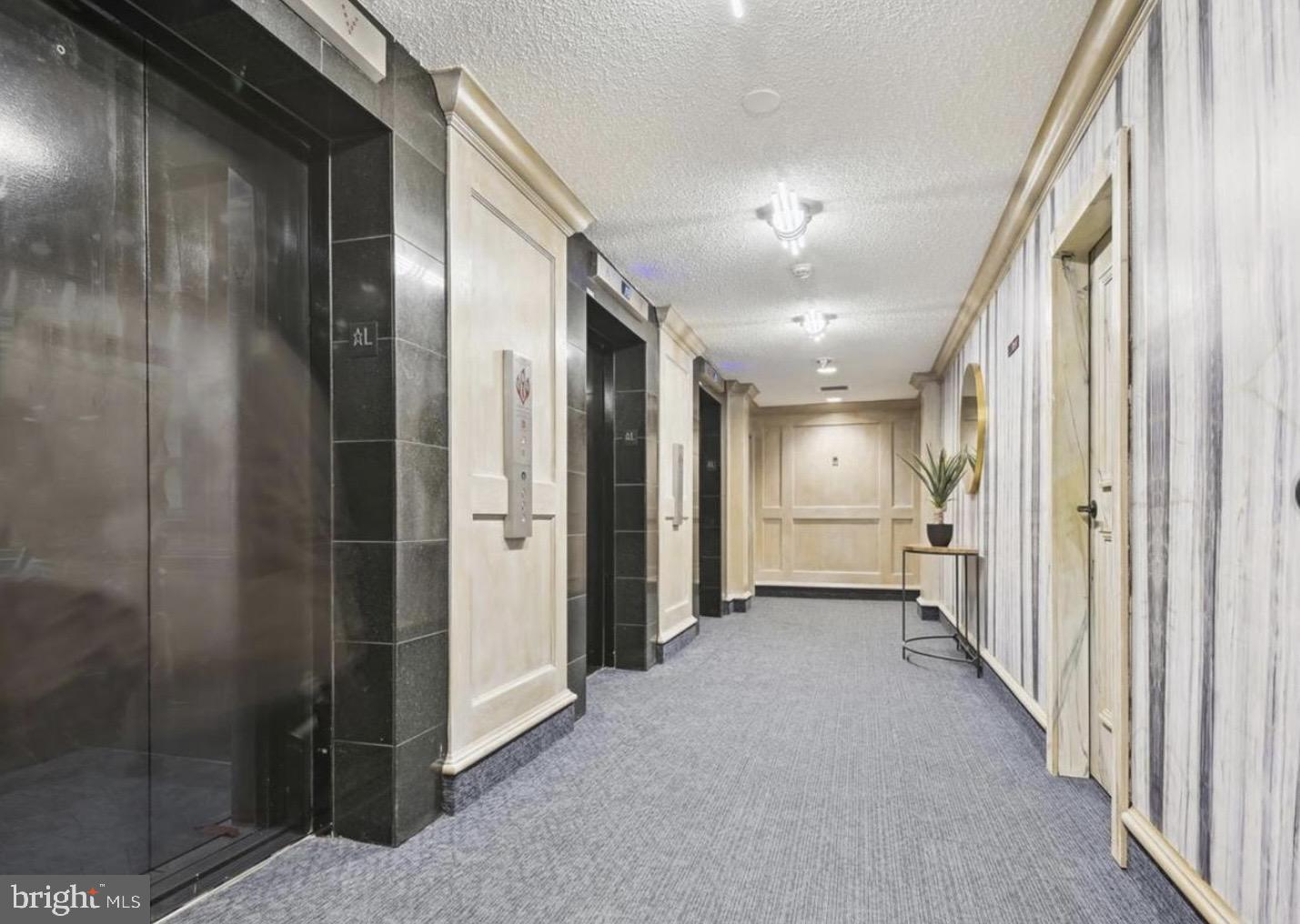 205 East Joppa Road, Unit 808 Towson, MD 21286 - Photo 6 of 37 Brightly lit elevator corridors