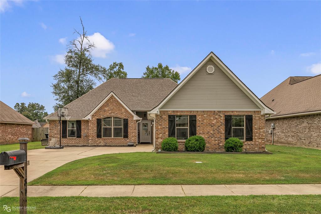 181 Bent Tree Loop Haughton, LA 71037 - Photo 1 of 1 View of front of property with brick siding, a shingled roof, and a front yard
