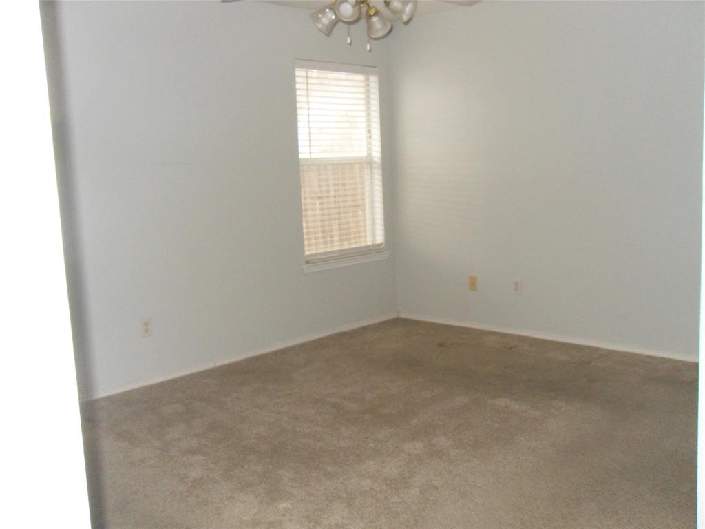 817 Cruise Street Denton, TX 76207 - Photo 14 of 17 an empty room with a window