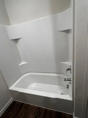 a close up of a bathtub in a bathroom