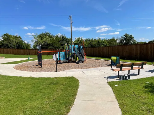 a view of a bench in a park