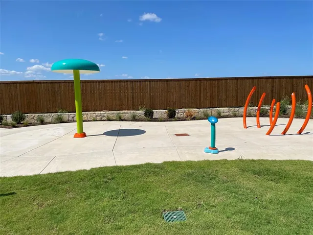 a swimming pool with an outdoor space and seating