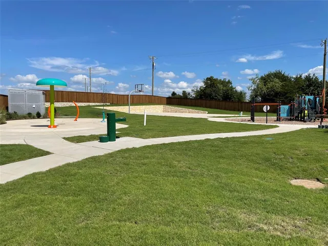 a view of a playground with basketball court