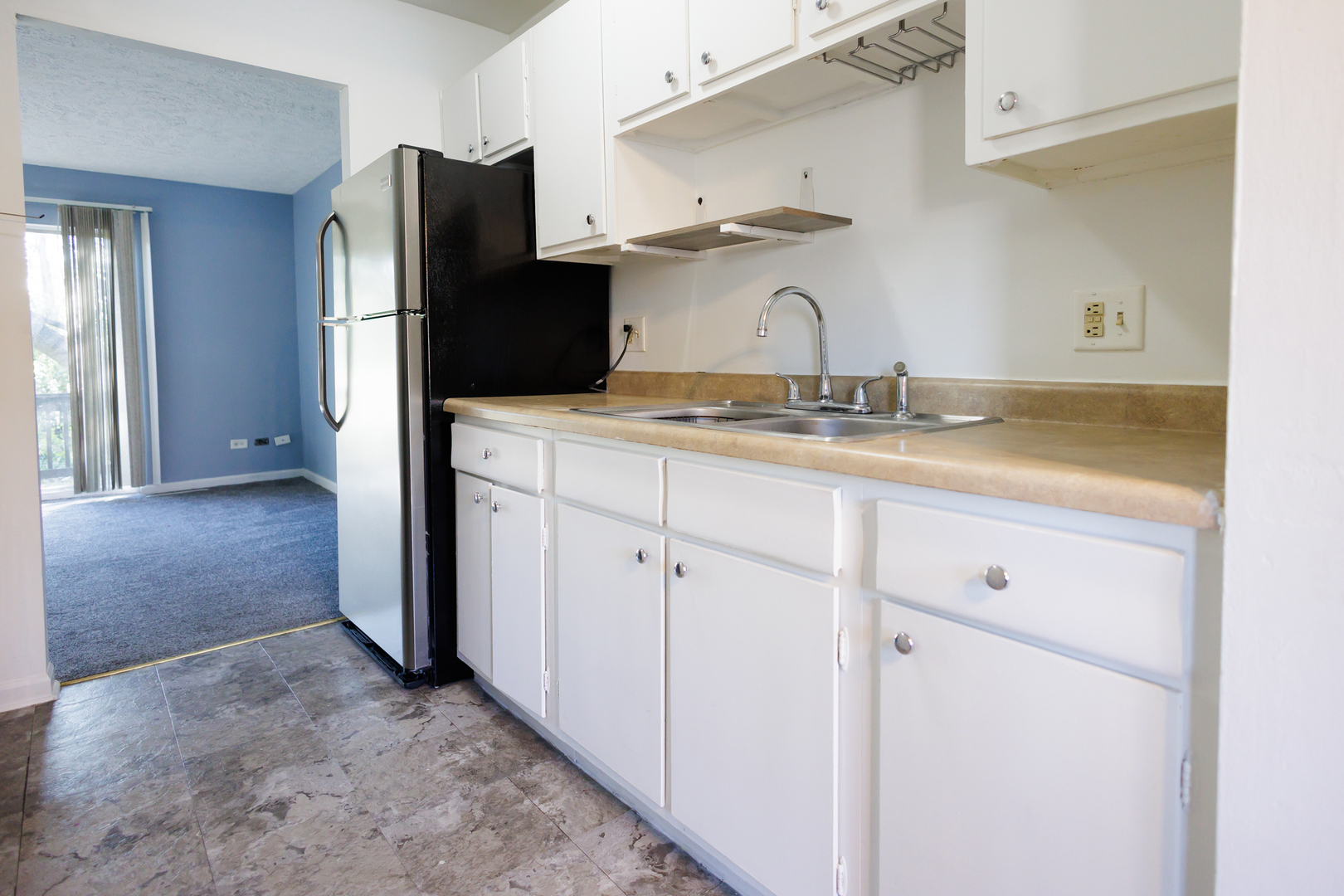 1119 South Curtis Avenue, Unit F62 Kankakee, IL 60901 - Photo 5 of 32 a kitchen with stainless steel appliances a refrigerator and cabinets