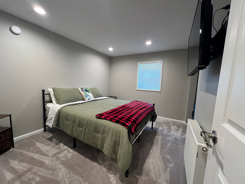 155 Cherry Run Road Rouseville, PA 16344 - Photo 8 of 19 a bedroom with a bed and a flat screen tv