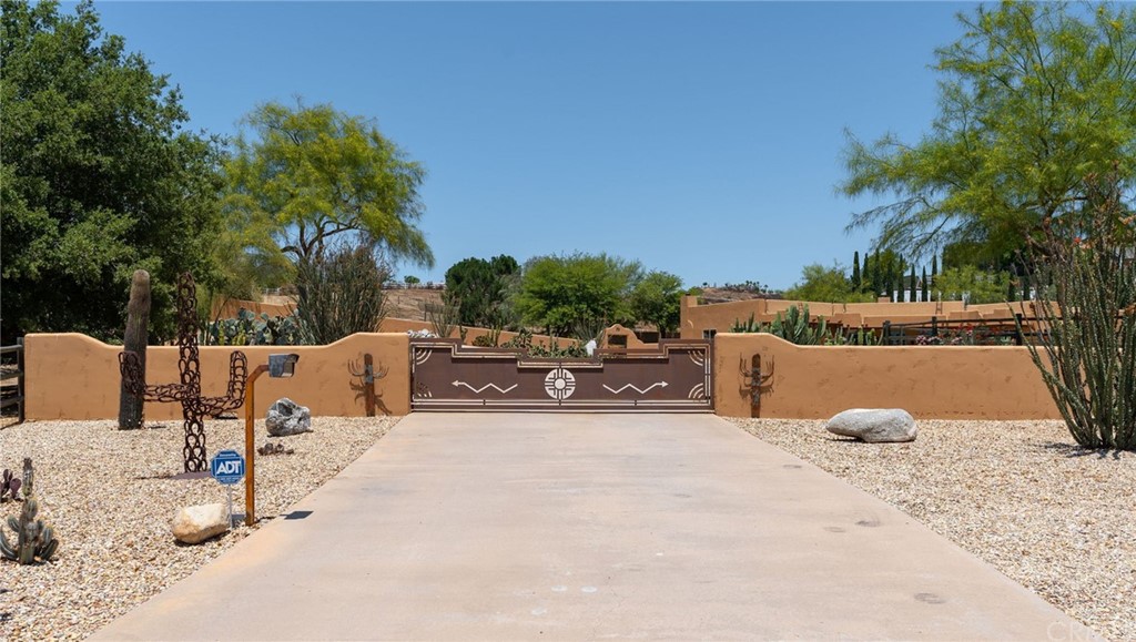 30620 Jedediah Smith Road Temecula, CA 92592 - Photo 3 of 36 a view of a terrace with a bench