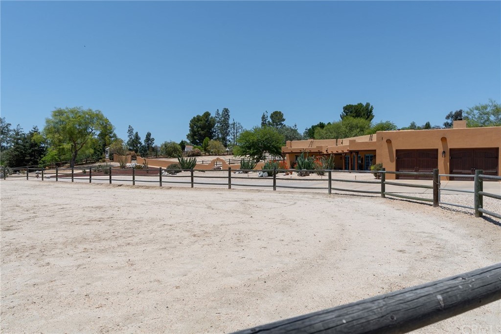 30620 Jedediah Smith Road Temecula, CA 92592 - Photo 32 of 36 a view of a swimming pool with a lawn chairs