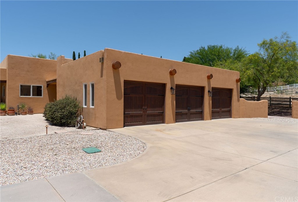 30620 Jedediah Smith Road Temecula, CA 92592 - Photo 5 of 36 a front view of a house with a yard
