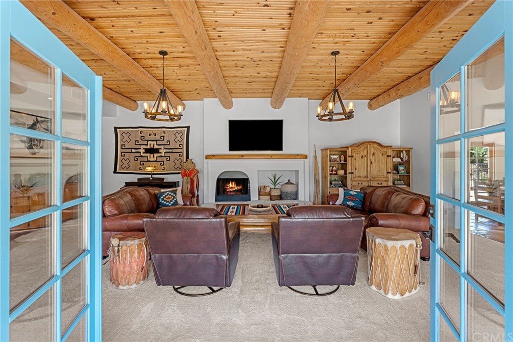 30620 Jedediah Smith Road Temecula, CA 92592 - Photo 10 of 36 a living room with furniture and a flat screen tv