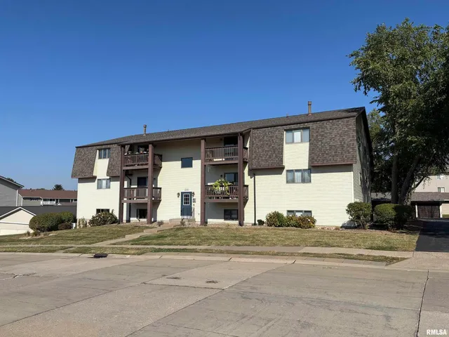 a view of a house with a street