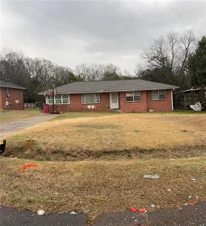 a front view of house with yard and lake view