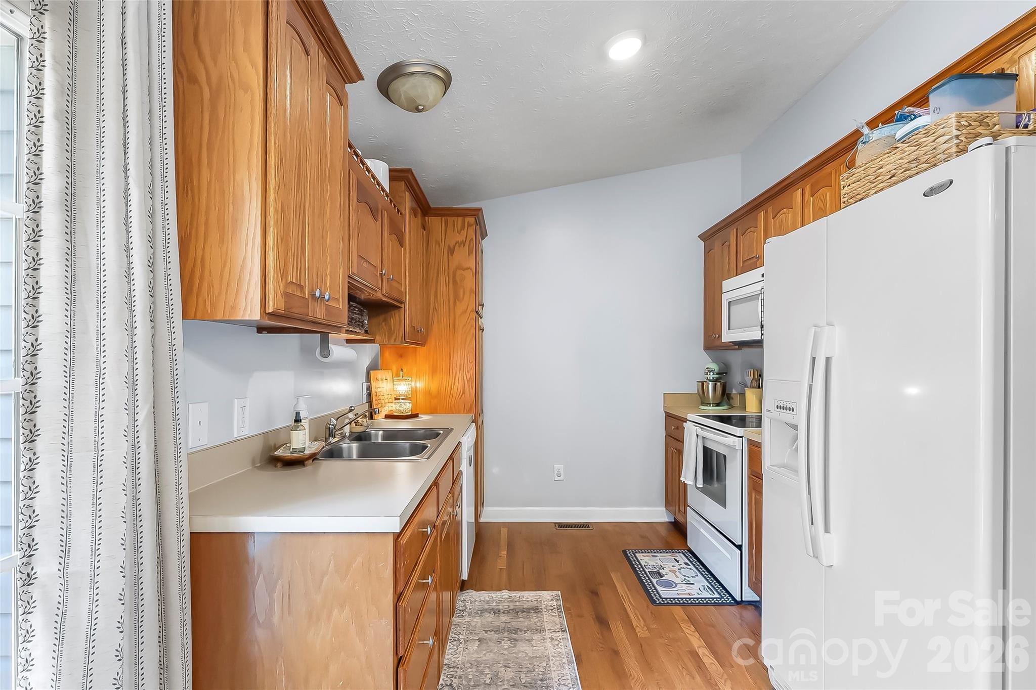 1498 Salem Road Morganton, NC 28655 - Photo 14 of 32 a kitchen with stainless steel appliances granite countertop a refrigerator and a stove