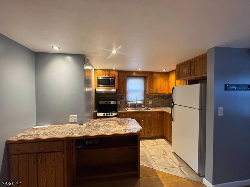 50 Jericho Road High Bridge, NJ 08829 - Photo 13 of 23 a kitchen with a refrigerator a sink and a stove