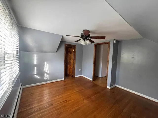 a view of a livingroom with wooden floor