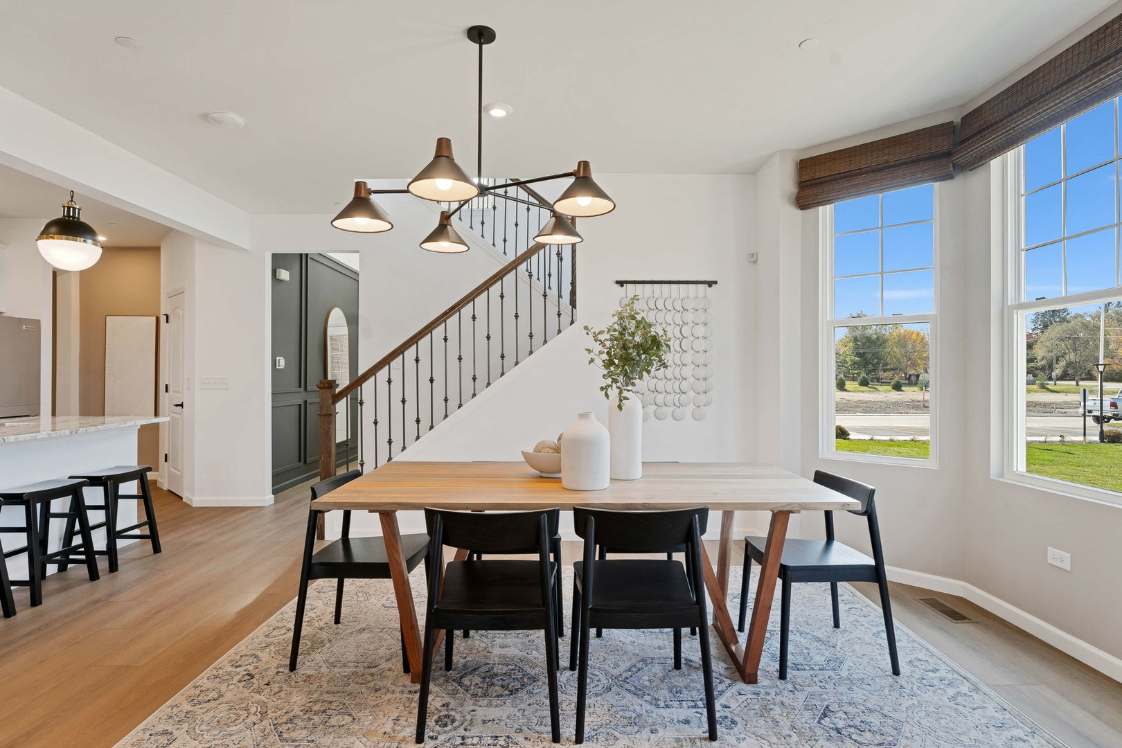 1035 Quarry Court, Unit 9 West Chicago, IL 60185 - Photo 11 of 23 a dining room with furniture a chandelier and wooden floor