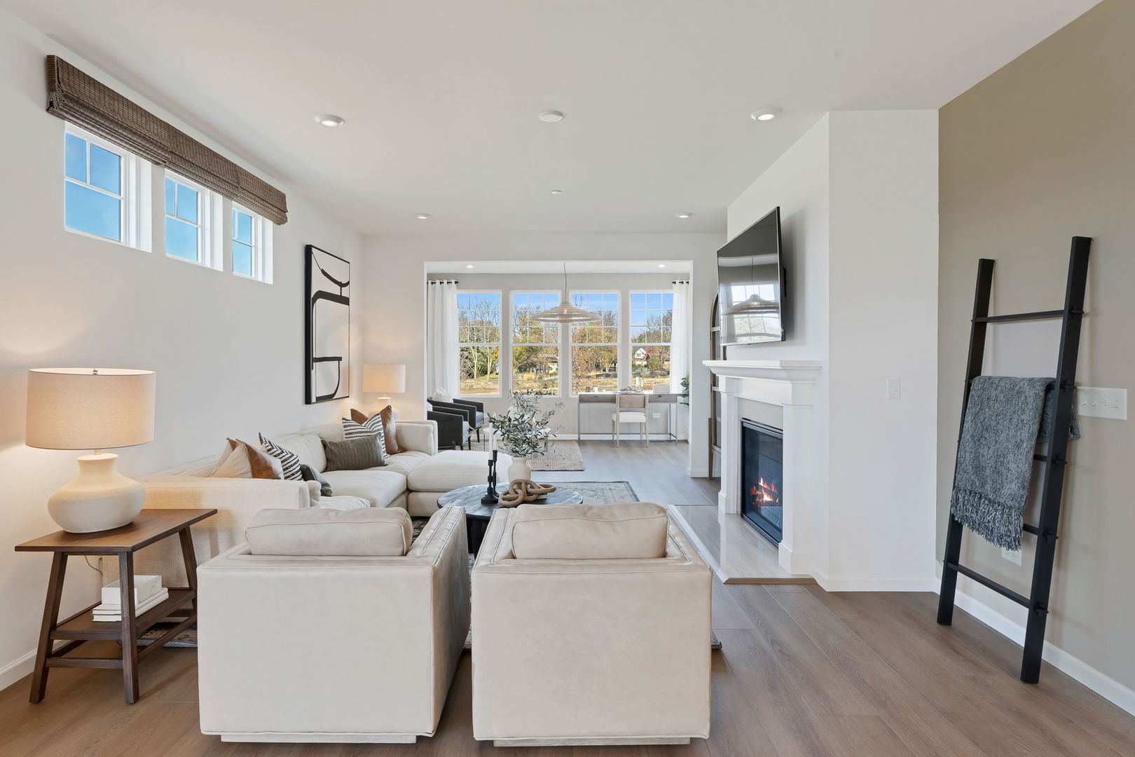 1035 Quarry Court, Unit 9 West Chicago, IL 60185 - Photo 14 of 23 a living room with furniture a fireplace and a large window