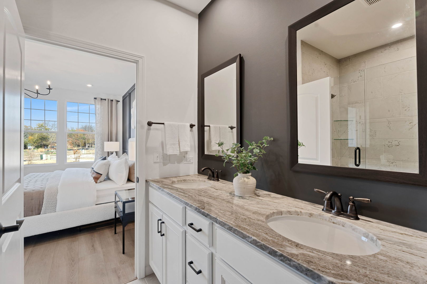 1035 Quarry Court, Unit 9 West Chicago, IL 60185 - Photo 20 of 23 a bathroom with a granite countertop double vanity sink a mirror and a bathtub