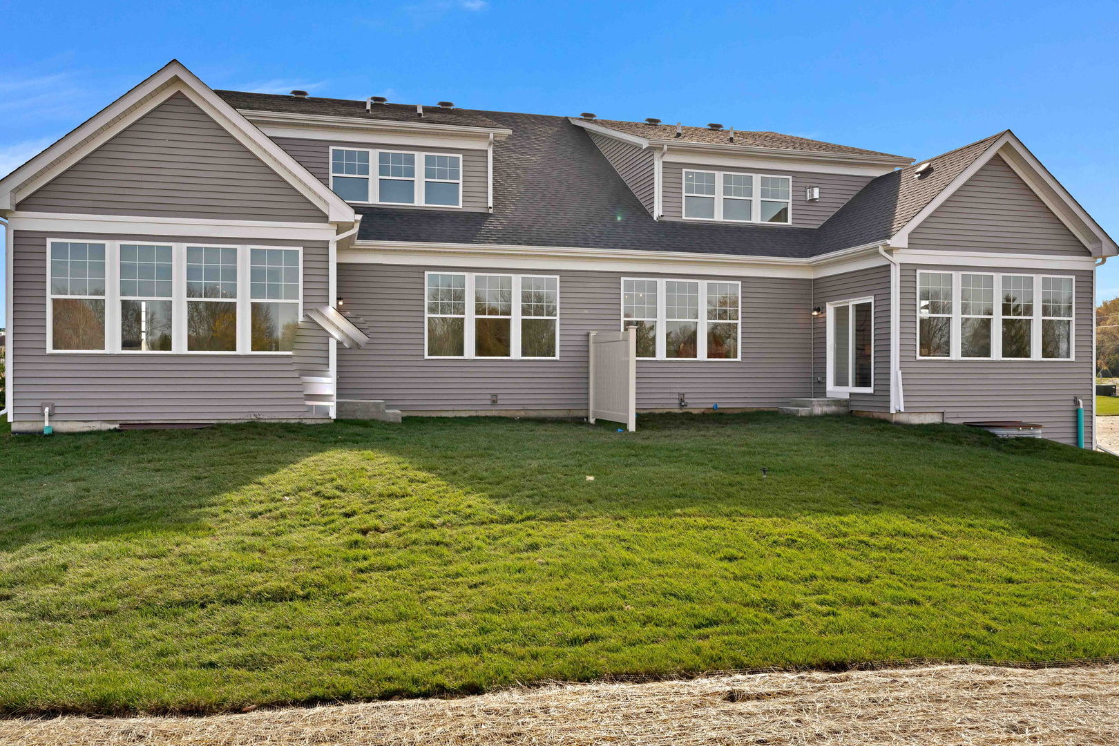 1035 Quarry Court, Unit 9 West Chicago, IL 60185 - Photo 2 of 23 a front view of a house with a garden