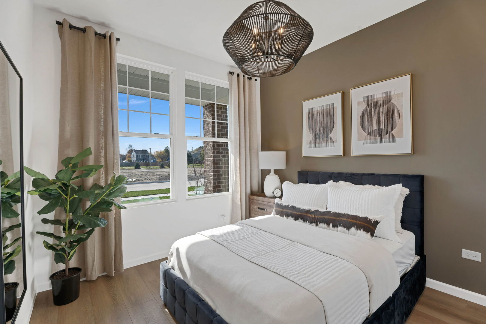 1035 Quarry Court, Unit 9 West Chicago, IL 60185 - Photo 22 of 23 a bedroom with a large bed and a chandelier