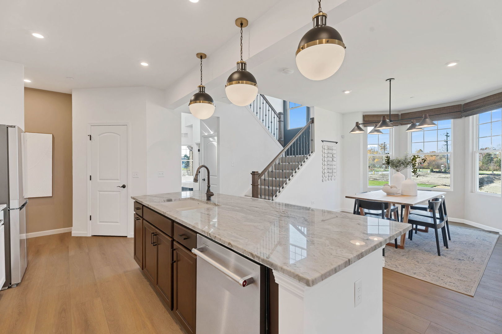 1035 Quarry Court, Unit 9 West Chicago, IL 60185 - Photo 8 of 23 a kitchen with stainless steel appliances granite countertop a sink a stove and refrigerator