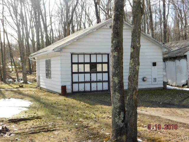 606 Rinker Road Stroudsburg, PA 18360 - Photo 3 of 21 a view of a house with a yard covered in snow