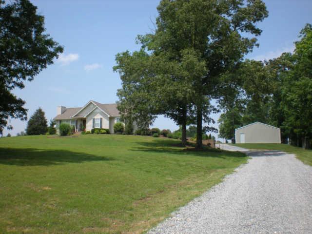 10025 Edwards Branch Road Primm Springs, TN 38476 - Photo 2 of 20 Setting on Nearly 8 gorgeous acres. Views abound. Fenced pasture, pond.Equestian friendly.