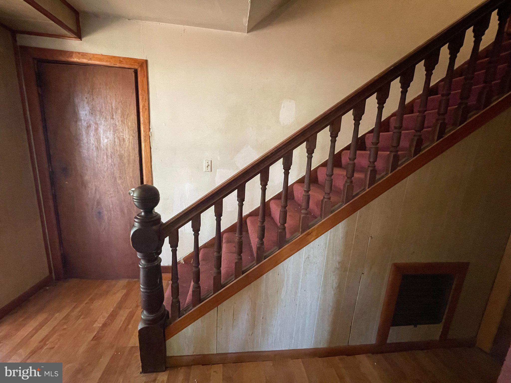 1113 Taylors Island Road Madison, MD 21648 - Photo 23 of 35 Original turned baluster, handrail, and newel post