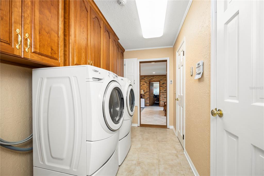 3897 Pinemount Road Lake City, FL 32024 - Photo 8 of 70 a utility room with dryer and washer