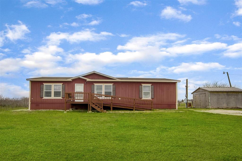 10240 Norrell Road Venus, TX 76084 - Photo 1 of 1 a front view of a house with a garden and yard