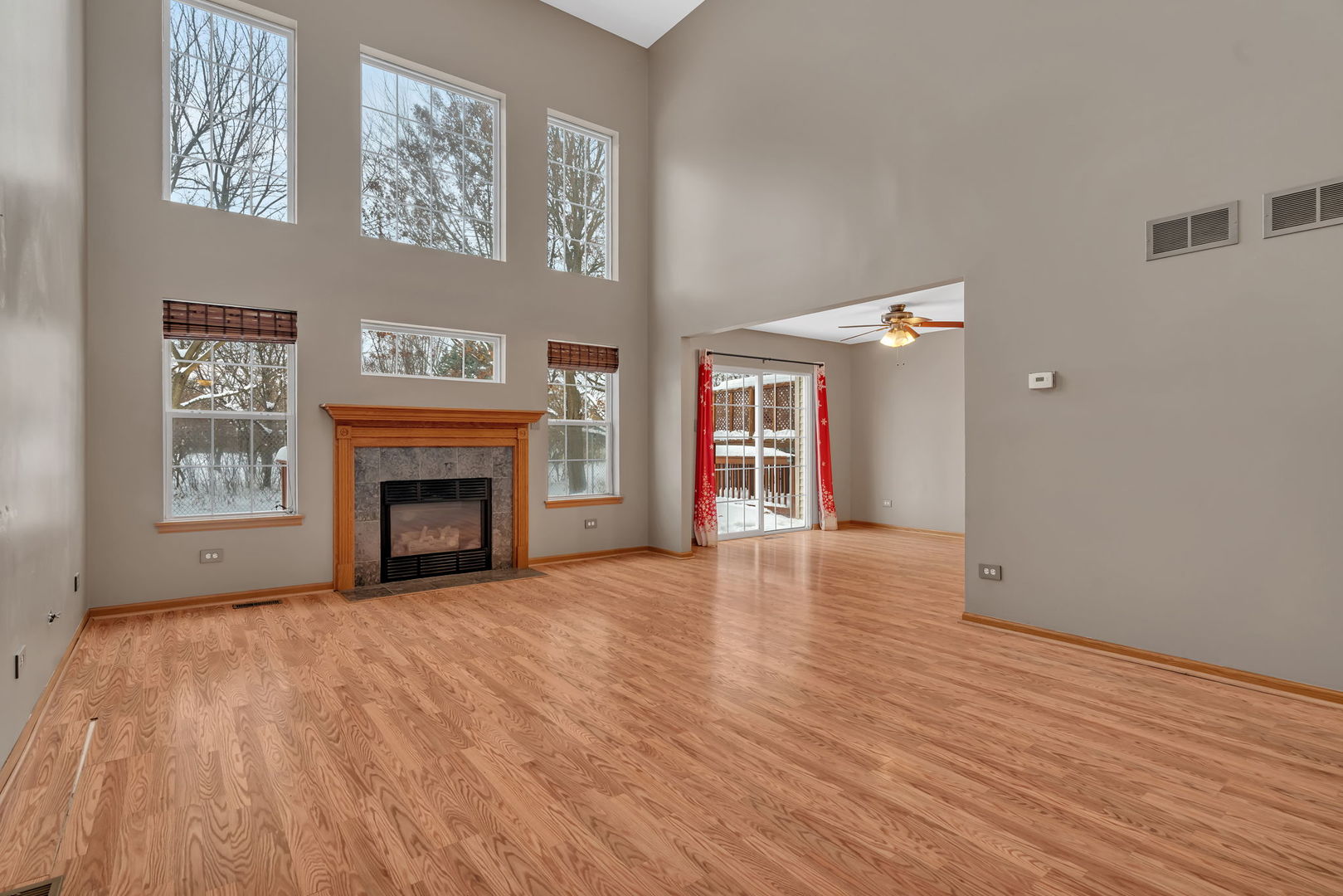 936 Treeline Court Lockport, IL 60441 - Photo 12 of 29 a view of empty room with wooden floor and fireplace