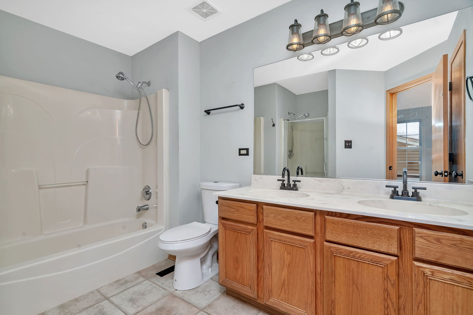 936 Treeline Court Lockport, IL 60441 - Photo 18 of 29 a bathroom with a sink a toilet and shower
