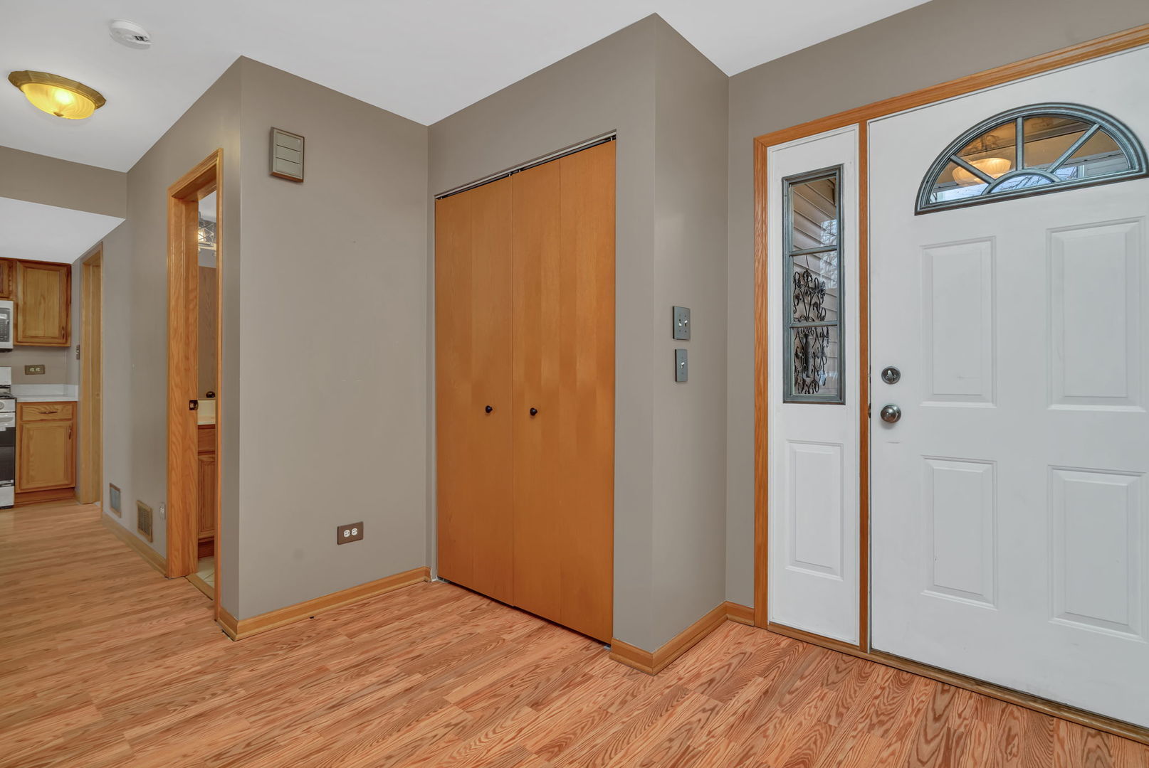 936 Treeline Court Lockport, IL 60441 - Photo 2 of 29 a view of a hallway with wooden floor and closet