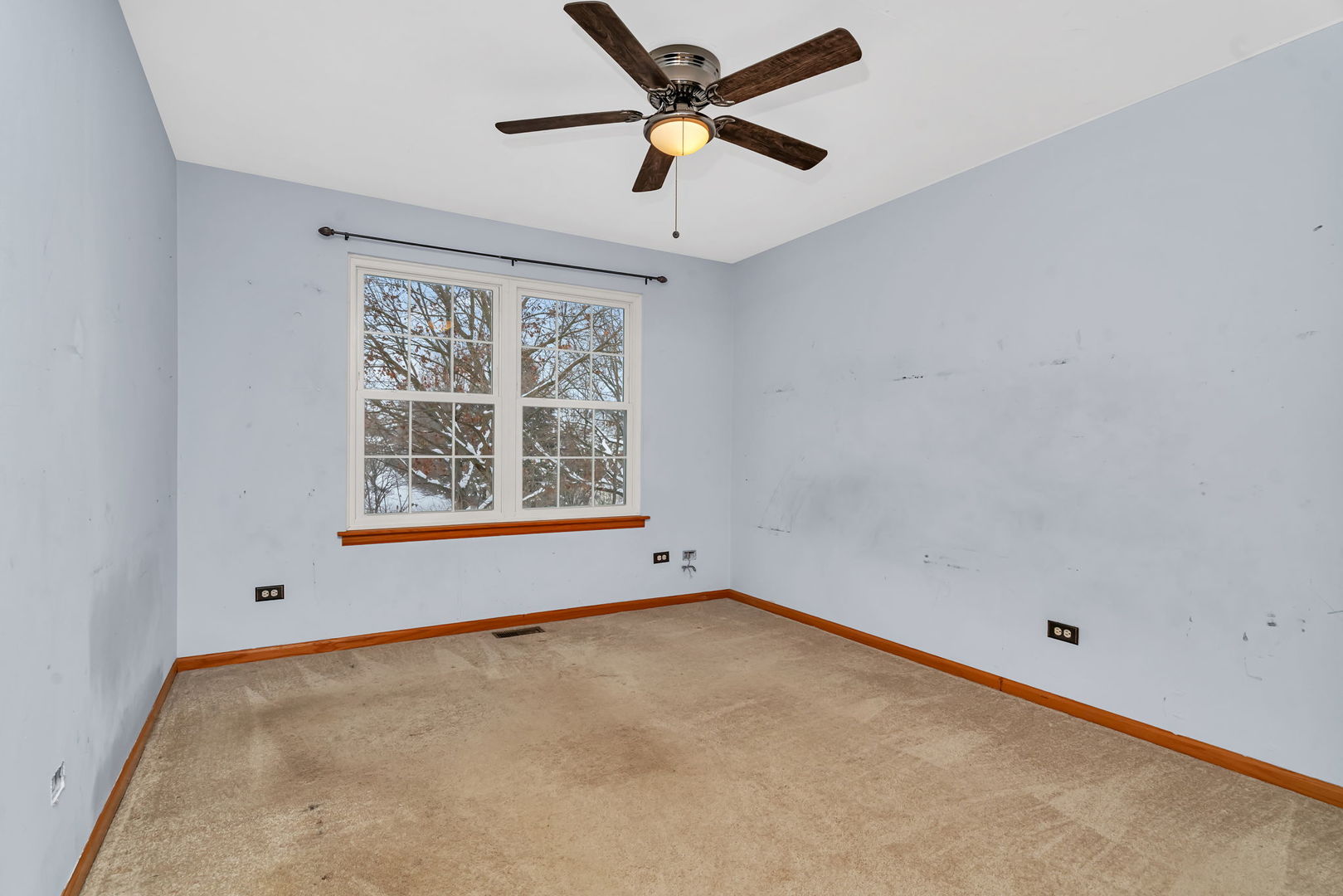 936 Treeline Court Lockport, IL 60441 - Photo 22 of 29 an empty room with a window and a fan