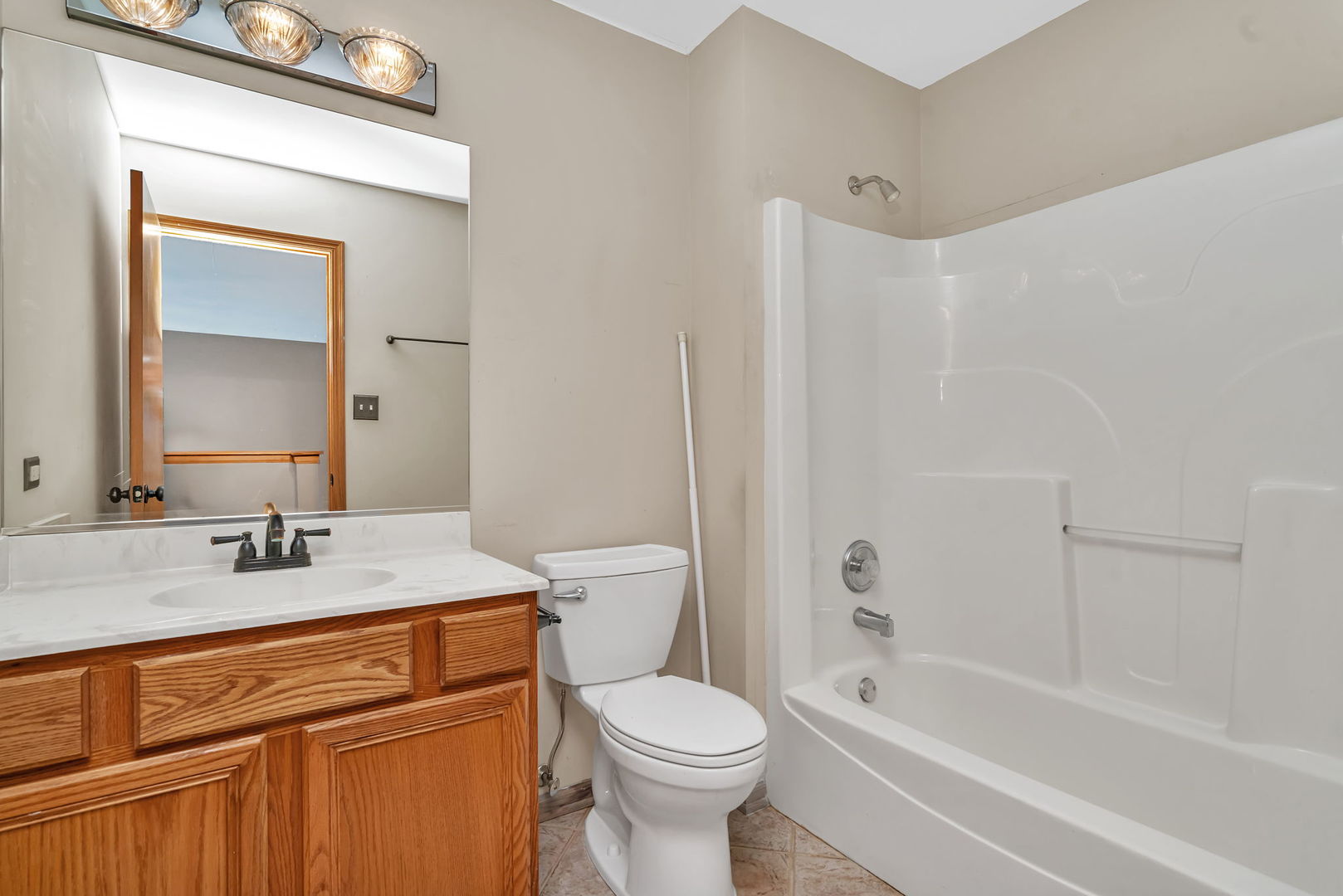 936 Treeline Court Lockport, IL 60441 - Photo 24 of 29 a bathroom with a sink toilet vanity and tub