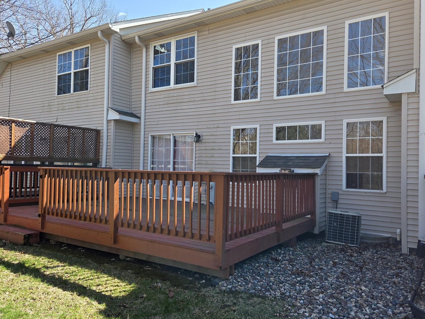 936 Treeline Court Lockport, IL 60441 - Photo 28 of 29 a view of a house with a small yard and wooden fence
