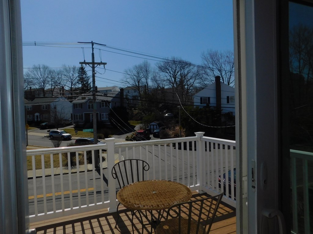 145 Lagrange Street Boston, MA 02132 - Photo 11 of 37 a view of a balcony with furniture