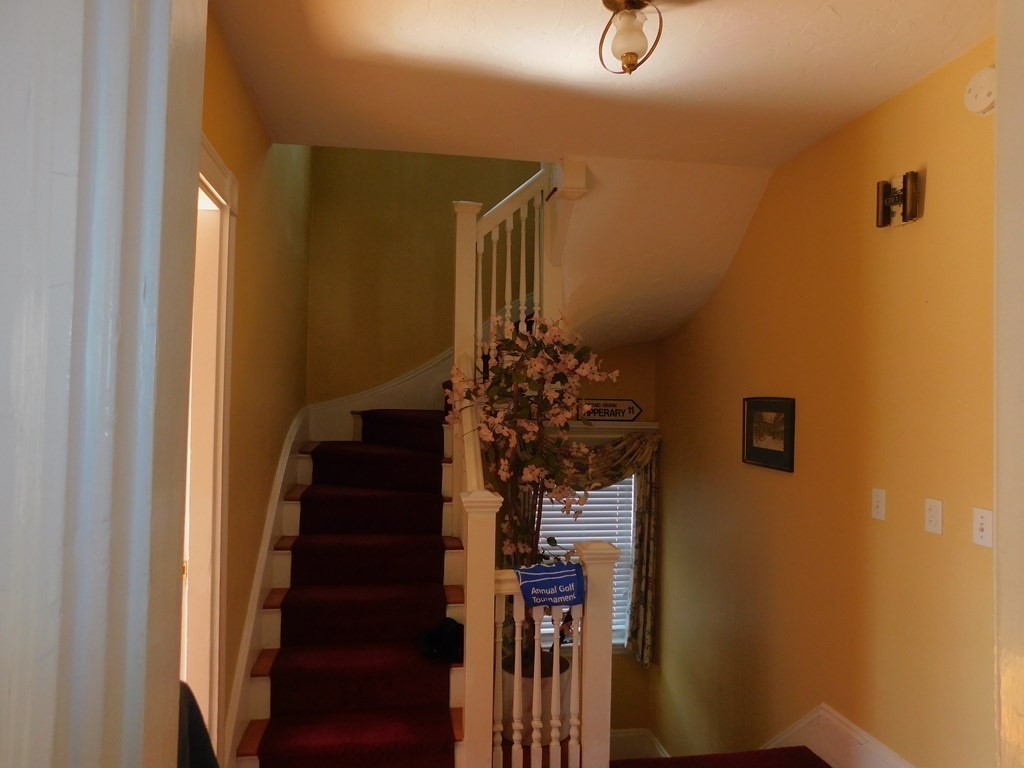 145 Lagrange Street Boston, MA 02132 - Photo 18 of 37 a view of entryway and hall with wooden floor