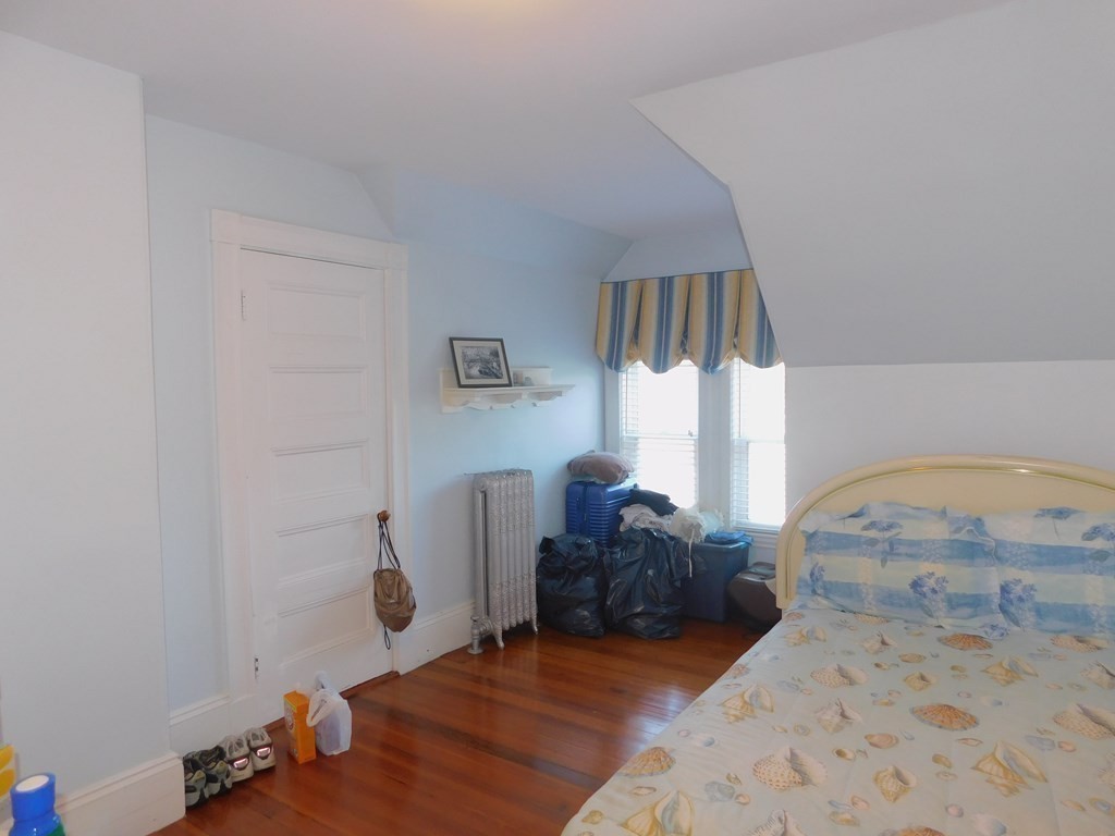 145 Lagrange Street Boston, MA 02132 - Photo 21 of 37 a living room with furniture and a window