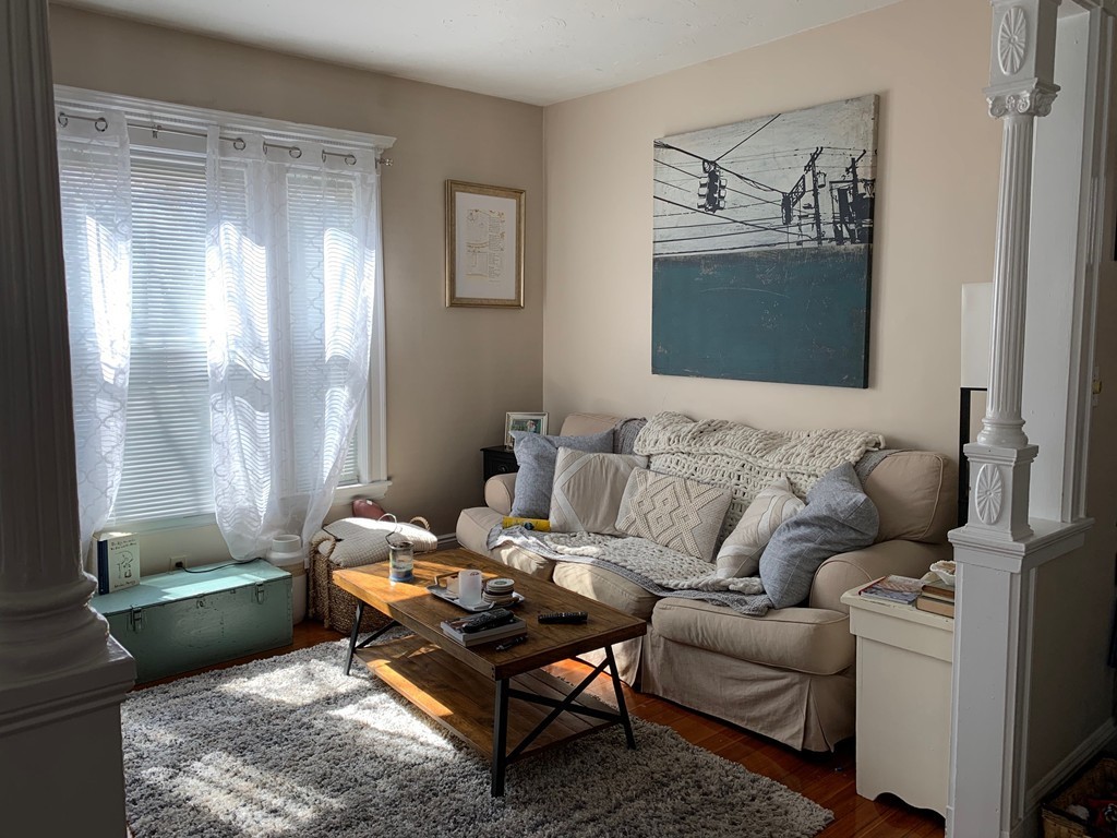 145 Lagrange Street Boston, MA 02132 - Photo 3 of 37 a living room with furniture and a window
