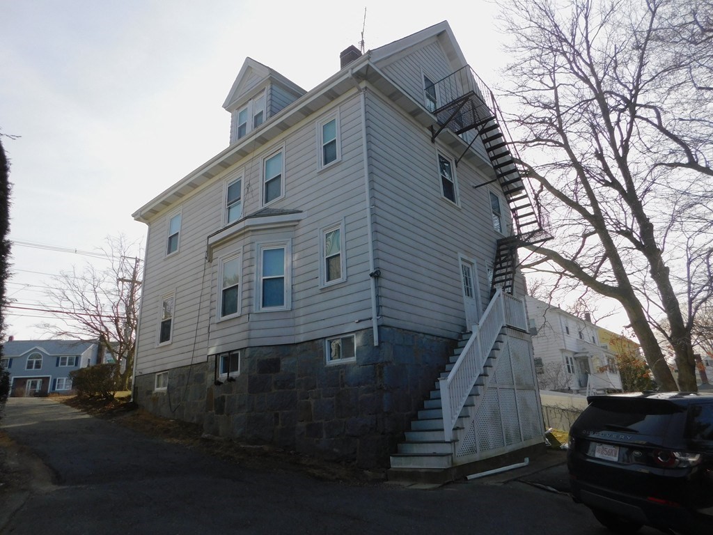 145 Lagrange Street Boston, MA 02132 - Photo 36 of 37 a view of a house with a yard