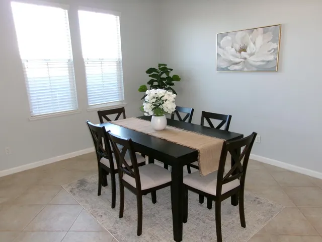 a view of a dining room with furniture
