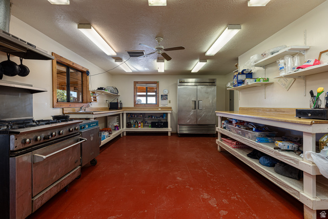 2040 North Long Cyn Road Kanab, UT 84741 - Photo 12 of 23 Kitchen featuring open shelves, a textured ceiling, high quality appliances, and ceiling fan
