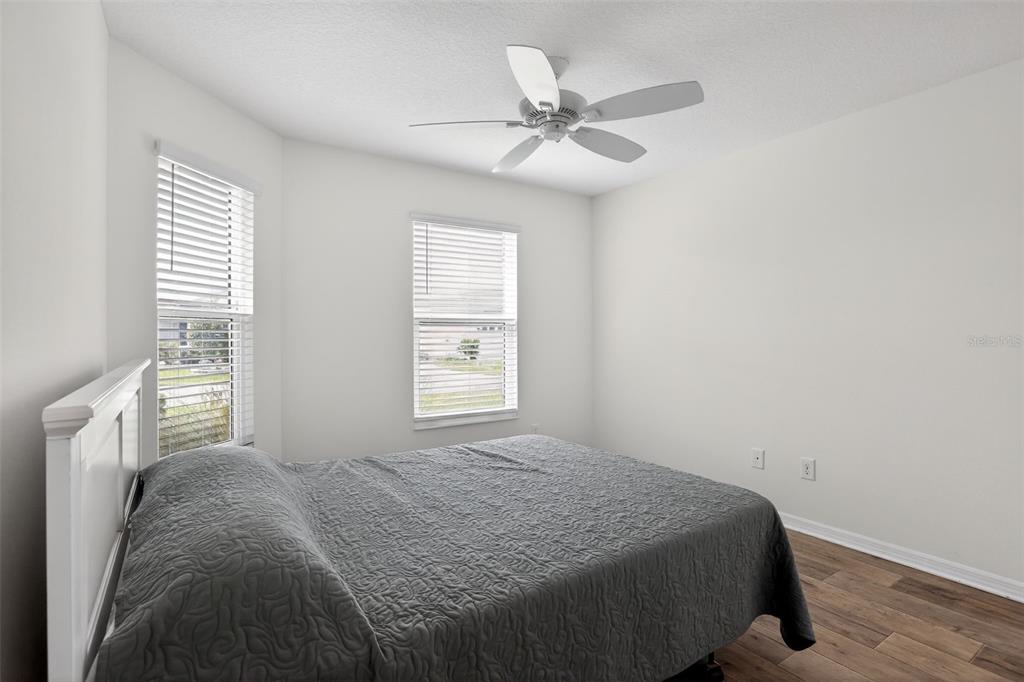 6273 Windham Way The Villages, FL 32163 - Photo 16 of 32 a bedroom with a bed and a window