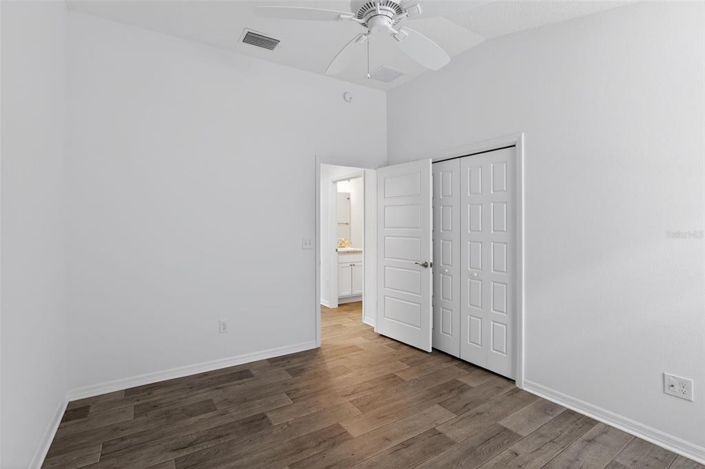 6273 Windham Way The Villages, FL 32163 - Photo 18 of 32 a view of an empty room and wooden floor