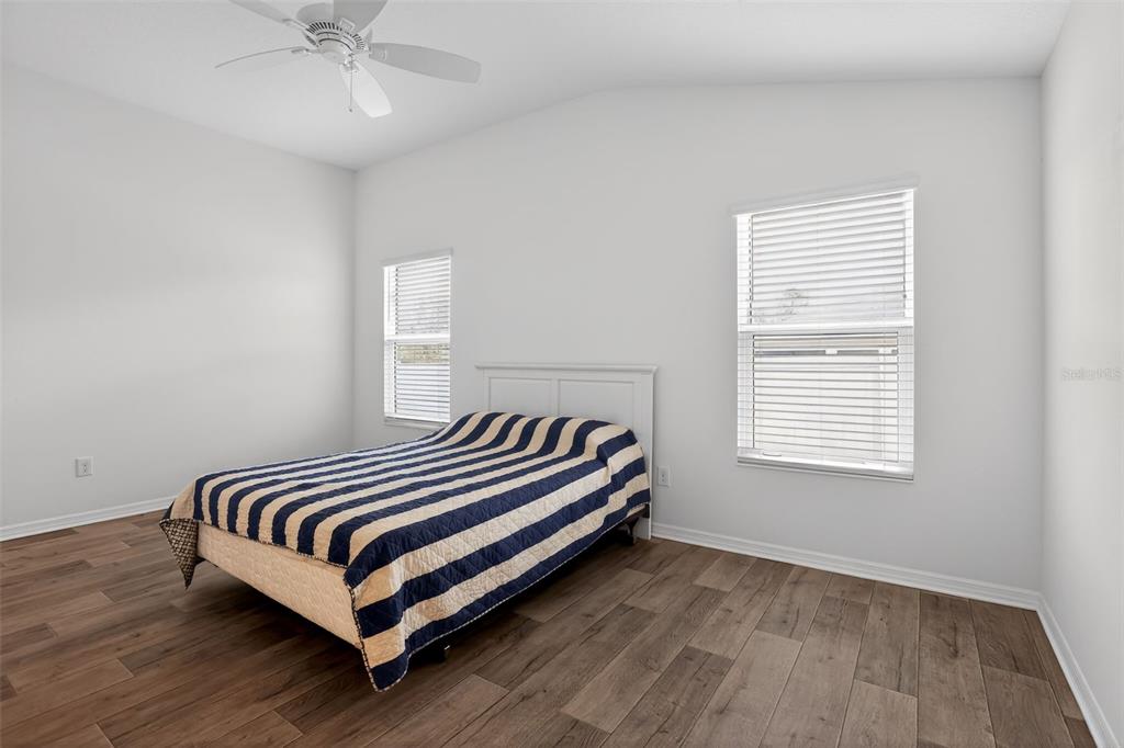 6273 Windham Way The Villages, FL 32163 - Photo 20 of 32 a bedroom with a bed and a window